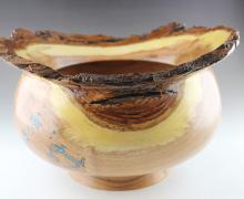 Wood bowl with turquoise inlay.